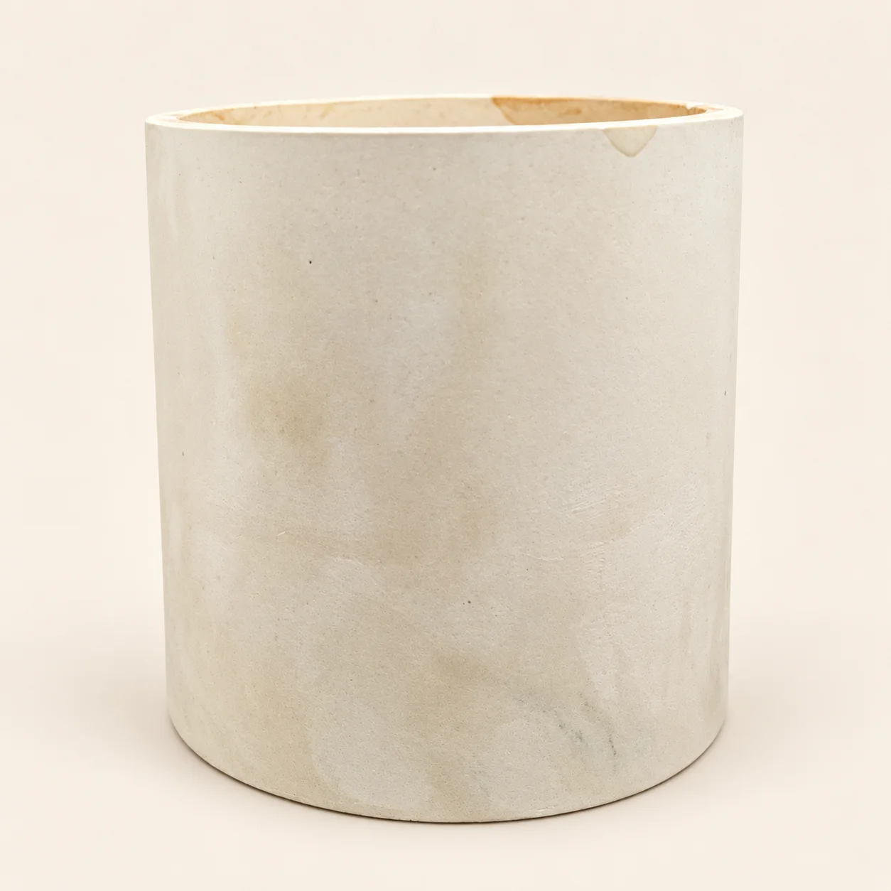 Ivory Stone: Front view of the Ivory Stone handmade concrete candle vessel